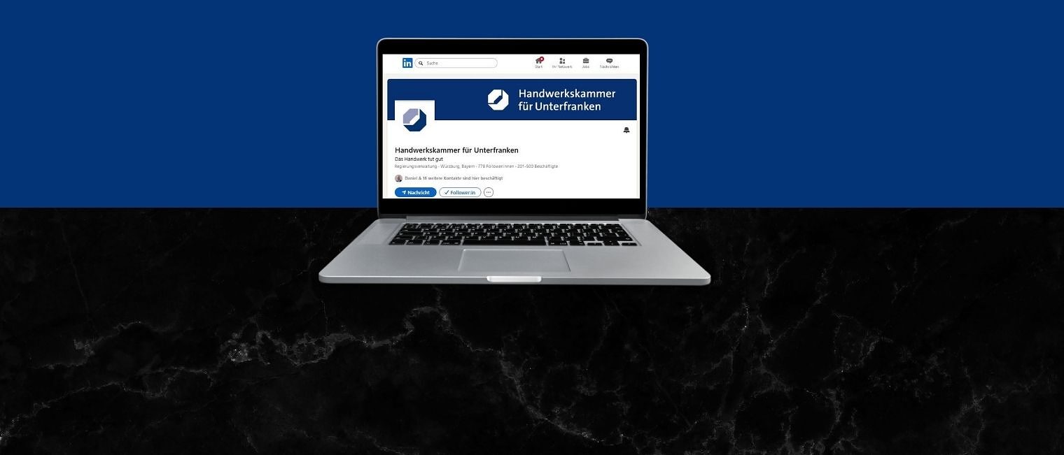 Laptop mit der LinkedIn-Seite der Handwerkskammer für Unterfranken Man sieht einen Laptop. Auf dem Bildschirm sieht man die LinkedIn-Seite der Handwerkskammer für Unterfranken